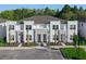 Modern townhome complex featuring neutral colors and manicured landscaping at 17220 Blessing Dr, Clermont, FL 34714