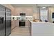 Bright kitchen featuring stainless steel appliances, modern cabinets, and a center island at 17220 Blessing Dr, Clermont, FL 34714