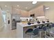 Open-concept kitchen featuring an island with bar seating and modern appliances at 17220 Blessing Dr, Clermont, FL 34714