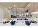 Bright kitchen featuring modern appliances, light wood cabinets, and a spacious white countertop at 17220 Blessing Dr, Clermont, FL 34714