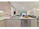 Well-appointed kitchen with quartz countertops and seamless flow to the living space at 17220 Blessing Dr, Clermont, FL 34714