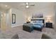Spacious main bedroom with ensuite bathroom, a large bed and neutral color palette at 17220 Blessing Dr, Clermont, FL 34714