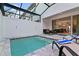 Enjoy the private pool and patio area with comfortable lounge chairs at 17220 Blessing Dr, Clermont, FL 34714