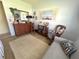 Comfortable bedroom area with a plush couch, decorative accents, and soft carpet at 224 Montana Ave, St Cloud, FL 34769