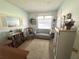 Bright bedroom featuring neutral decor, a comfortable couch, and a cozy carpet at 224 Montana Ave, St Cloud, FL 34769