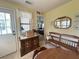 Cozy dining area with wood furniture, decor and view to the back entry and bedroom at 224 Montana Ave, St Cloud, FL 34769