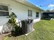 Exterior view of AC unit situated in the home's side yard at 224 Montana Ave, St Cloud, FL 34769