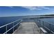 Fishing pier with benches overlooking the lake, offering a tranquil spot for fishing and relaxation at 224 Montana Ave, St Cloud, FL 34769