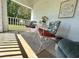 Inviting front porch area featuring cozy seating and a charming decorative touch at 224 Montana Ave, St Cloud, FL 34769