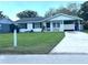 Charming single-story home boasts a well-manicured lawn, a covered porch, and a convenient driveway at 224 Montana Ave, St Cloud, FL 34769