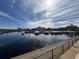 Scenic marina view with boats docked under a bright, partly cloudy sky, showcasing waterfront amenities at 224 Montana Ave, St Cloud, FL 34769