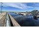 Picturesque marina featuring multiple boats docked with calm water, reflecting the sky and the building at 224 Montana Ave, St Cloud, FL 34769