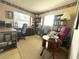 Well-organized home office featuring a spacious desk, ample bookshelves, and comfortable seating at 224 Montana Ave, St Cloud, FL 34769
