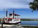 Charming riverboat named 'Pearl of the Lake' docked on the shore, ready for riverboat adventures at 224 Montana Ave, St Cloud, FL 34769