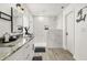 Modern bathroom featuring a walk-in shower, dual vanity, and elegant marble accents at 2313 Duncan Trl, Clermont, FL 34714
