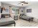 Charming bedroom featuring two twin beds, modern décor, and plenty of natural light for a cozy atmosphere at 2313 Duncan Trl, Clermont, FL 34714