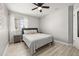Bright bedroom showcasing wood-look flooring, ample natural light, and neutral paint at 2313 Duncan Trl, Clermont, FL 34714