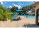 Beautiful view of community pool with tables, umbrellas and lots of seating at 2313 Duncan Trl, Clermont, FL 34714