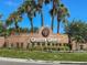 Community sign for Greater Groves with brick and lush landscaping at 2313 Duncan Trl, Clermont, FL 34714
