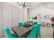 Elegant dining area featuring a modern table, chandelier, and large windows, for Gathering gatherings at 2313 Duncan Trl, Clermont, FL 34714