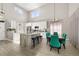 Bright and airy kitchen with an island, stainless appliances, with an adjacent dining table at 2313 Duncan Trl, Clermont, FL 34714