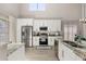 Kitchen with stainless steel appliances and ample counter space, perfect for cooking and entertaining at 2313 Duncan Trl, Clermont, FL 34714
