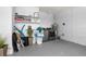 Bright laundry room with modern appliances, storage shelves, and ample space at 2313 Duncan Trl, Clermont, FL 34714