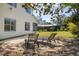 Inviting patio with lounge seating surrounded by lush landscaping and a serene backyard at 2313 Duncan Trl, Clermont, FL 34714