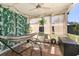 Comfortable sunroom featuring a hammock and decorative lighting at 2313 Duncan Trl, Clermont, FL 34714