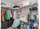 Functional walk-in closet featuring built-in shelving, drawers and ample storage space for organization at 2313 Duncan Trl, Clermont, FL 34714