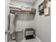 This organized walk-in closet boasts practical storage solutions and a sleek laminate floor at 2313 Duncan Trl, Clermont, FL 34714