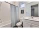 Clean bathroom with a shower-tub combination, white vanity, and a framed art piece at 2372 Sirena Ln, Mount Dora, FL 32757