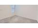 Neutral bedroom features carpeted floors, a window with blinds, and is ready for customization at 2372 Sirena Ln, Mount Dora, FL 32757