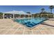 Large community swimming pool with a spacious sundeck and plenty of seating at 2372 Sirena Ln, Mount Dora, FL 32757