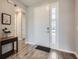 Welcoming foyer with tiled flooring, a side table and views into other rooms at 2372 Sirena Ln, Mount Dora, FL 32757