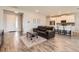 Inviting open-concept living room featuring wood floors and bright natural light at 2372 Sirena Ln, Mount Dora, FL 32757