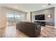 Spacious living room featuring a large sliding glass door to an outside patio at 2372 Sirena Ln, Mount Dora, FL 32757