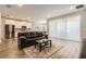 Inviting open-concept living room with hardwood floors and bright natural light at 2372 Sirena Ln, Mount Dora, FL 32757