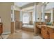 Open bathroom showcases a soaking tub, walk-in shower, and dual vanities at 2375 Pinehurst Ct, Davenport, FL 33837