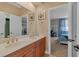 Spacious bathroom boasts double sinks and a view into an adjoining bedroom at 2375 Pinehurst Ct, Davenport, FL 33837