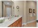 Classic bathroom features updated vanity, countertop with decor and towel racks at 2375 Pinehurst Ct, Davenport, FL 33837