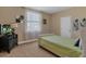 Cozy bedroom features a simple bed, dark dresser, and neutral walls, creating a peaceful retreat at 2375 Pinehurst Ct, Davenport, FL 33837