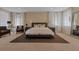 Spacious bedroom features neutral decor, large windows and comfortable furniture at 2375 Pinehurst Ct, Davenport, FL 33837