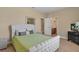 Well-lit bedroom showcasing ensuite bathroom access and a modern entertainment area at 2375 Pinehurst Ct, Davenport, FL 33837
