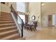 Elegant dining room featuring a staircase and a sophisticated chandelier at 2375 Pinehurst Ct, Davenport, FL 33837