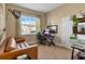 Comfortable home office with large window and modern decor elements at 2375 Pinehurst Ct, Davenport, FL 33837