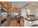 Well-equipped kitchen with stainless steel appliances, granite countertops, and central island at 2375 Pinehurst Ct, Davenport, FL 33837