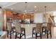 Well-lit kitchen featuring a breakfast bar with rattan seating and modern appliances at 2375 Pinehurst Ct, Davenport, FL 33837