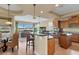 Open kitchen with breakfast bar, stainless appliances, and ample cabinet space at 2375 Pinehurst Ct, Davenport, FL 33837