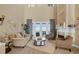 Cozy living room featuring a fireplace, high ceilings, and neutral tones at 2375 Pinehurst Ct, Davenport, FL 33837